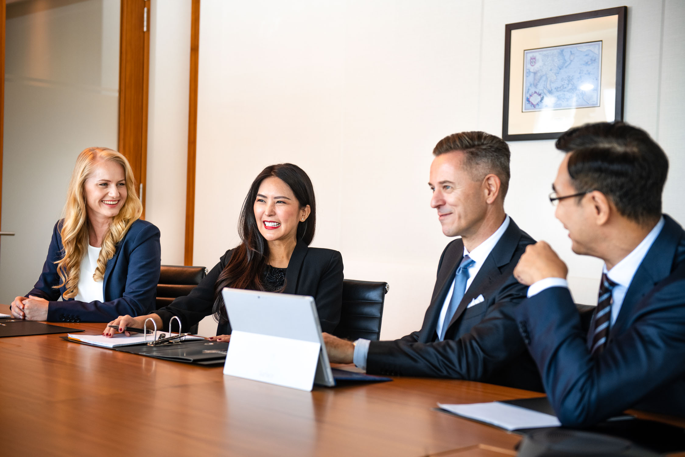 Corporate individuals and business professionals in a photography studio setting during a corporate photoshoot in Singapore, White Room Studio. Credit: White Room Studio Pte Ltd